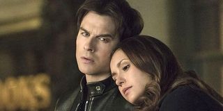 The Vampire Diaries Elena leans on Damon's shoulder The CW