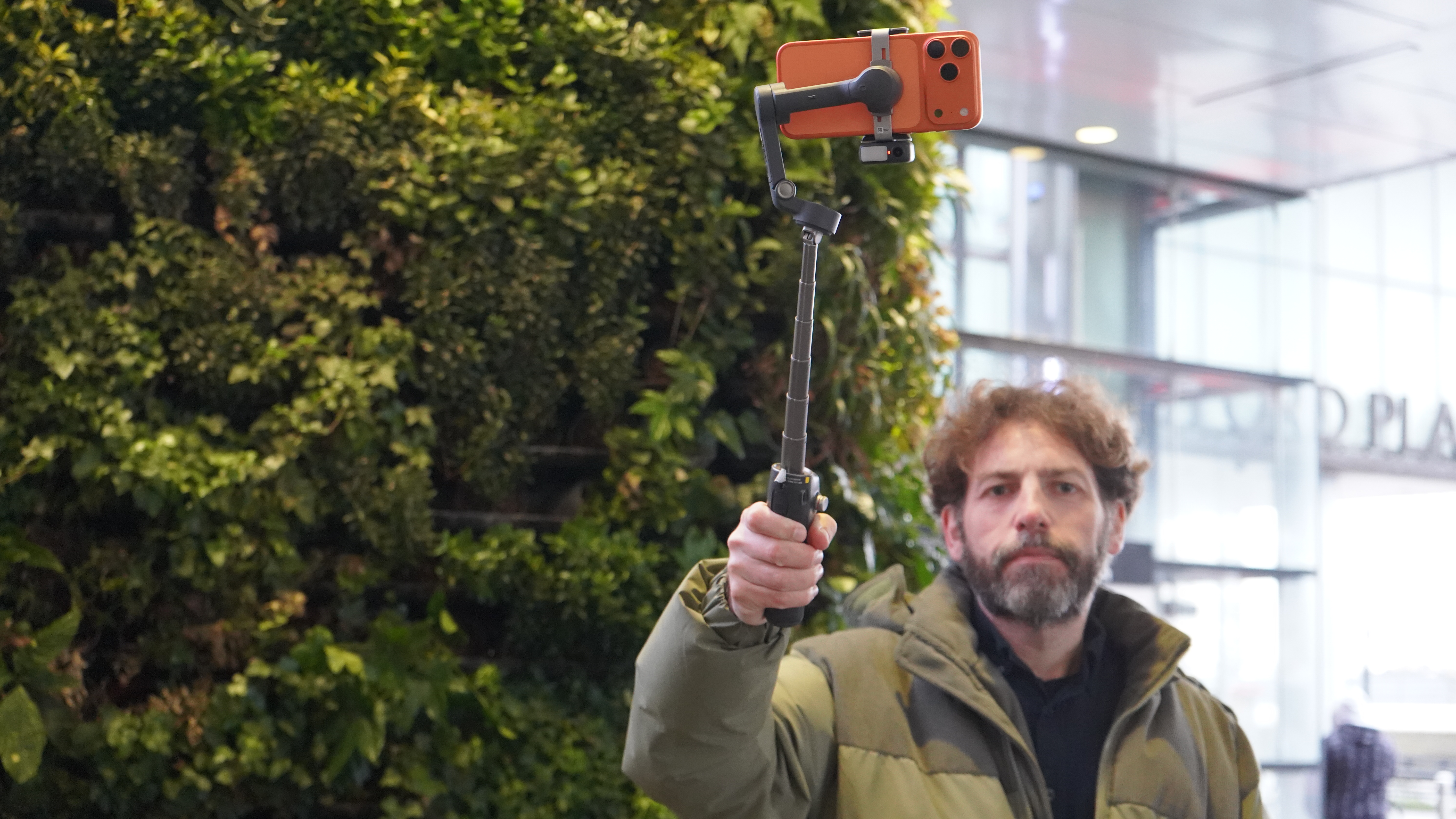 Adam Juniper holding extended DJI Osmo Mobile 8