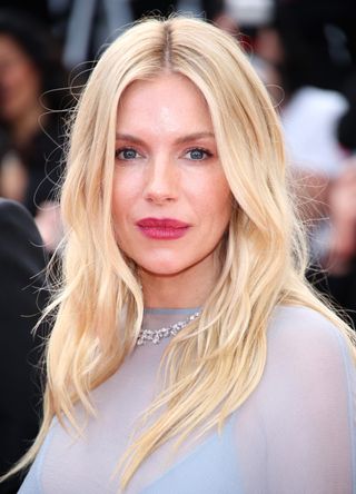 Sienna Miller attends the "Horizon: An American Saga" Red Carpet at the 77th annual Cannes Film Festival at Palais des Festivals on May 19, 2024 in Cannes, France