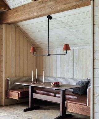 Wooden nook, brown leather bench, wooden table