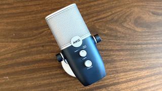 AKG Ara usb microphone on a wooden tabletop
