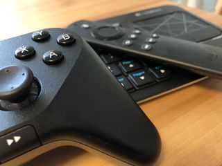 The Amazon Game Controller, Voice Remote, and a Logitech Bluetooth keyboard with trackpad.