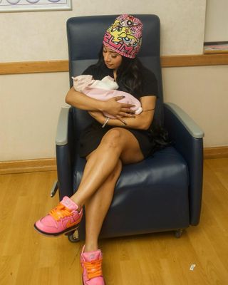 Cardi B holding her new baby