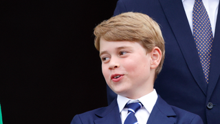 Queen Elizabeth II and Prince George of Cambridge stand on the balcony of Buckingham Palace following the Platinum Pageant on June 5, 2022 in London, England