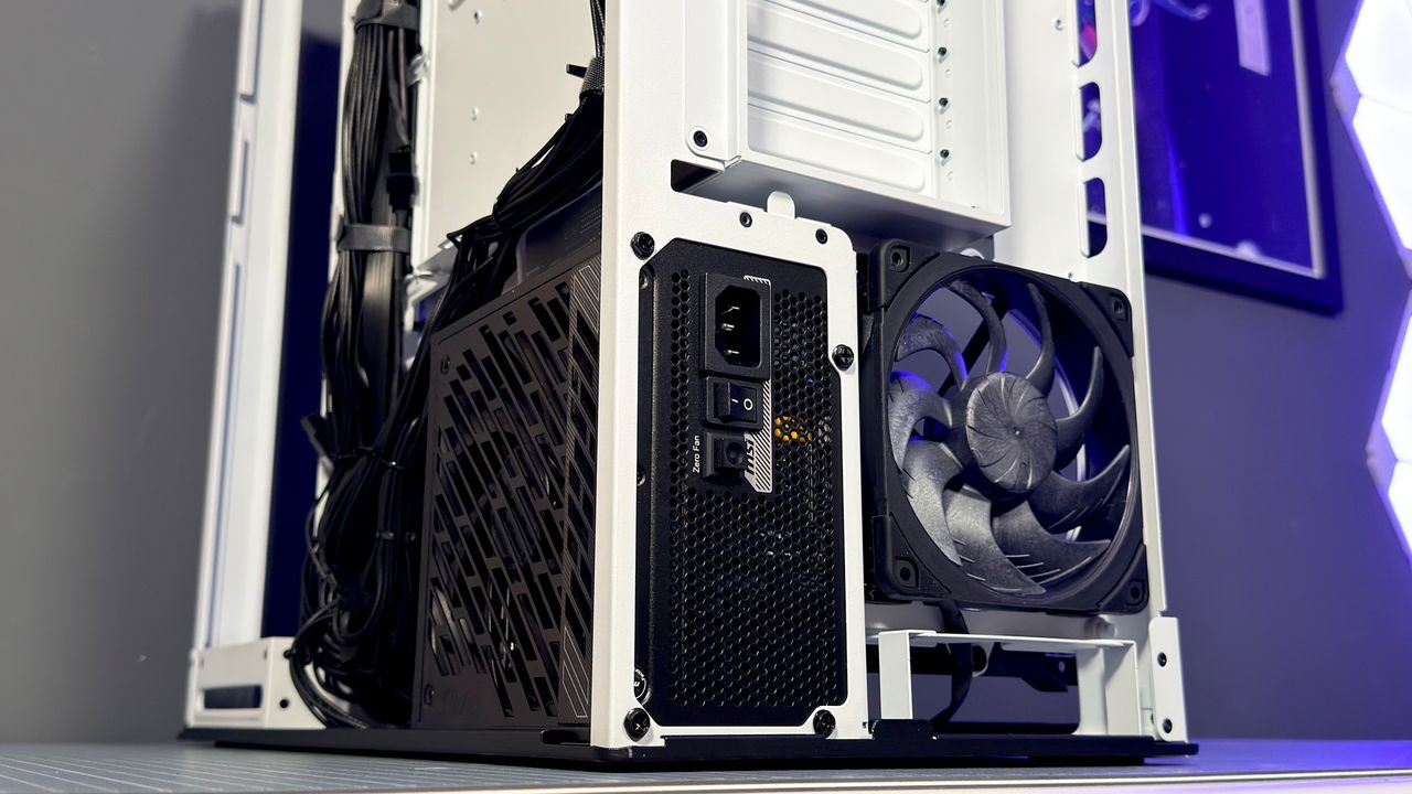 The Havn HS 360 PC case in black and white on a desk.