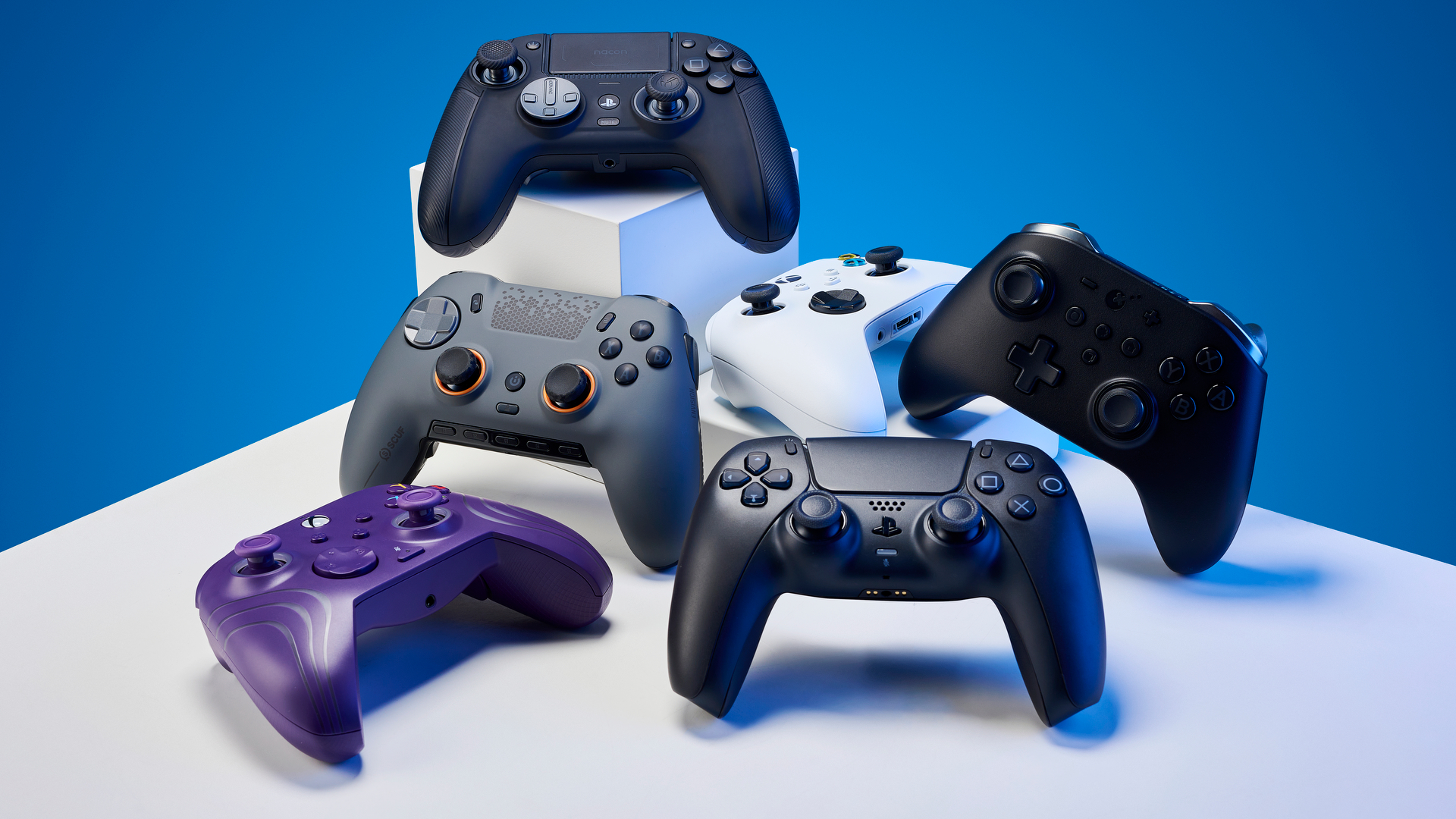 A collection of controllers on a blue background.