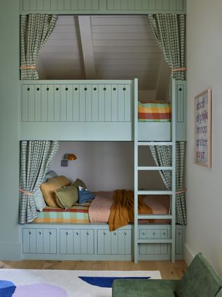 built-in bunk beds painted sage green with curtains