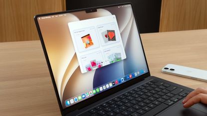 A person using iPhone Mirroring on a MacBook Pro running macOS 27 Golden Gate.