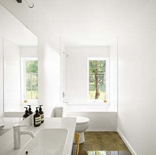 minimalist bathroom with slit window at Hem House by Future Firm In Chicago