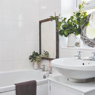A Christmas-decorated white bathroom