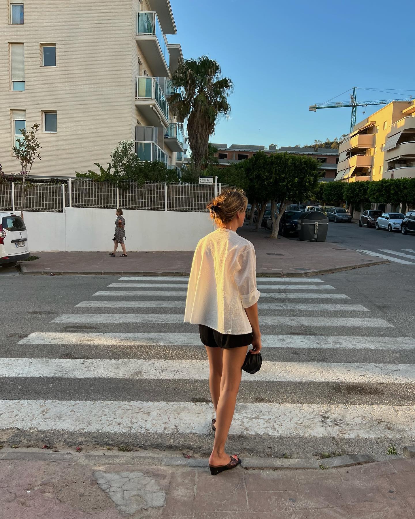 Influencer wears a wedge mule.