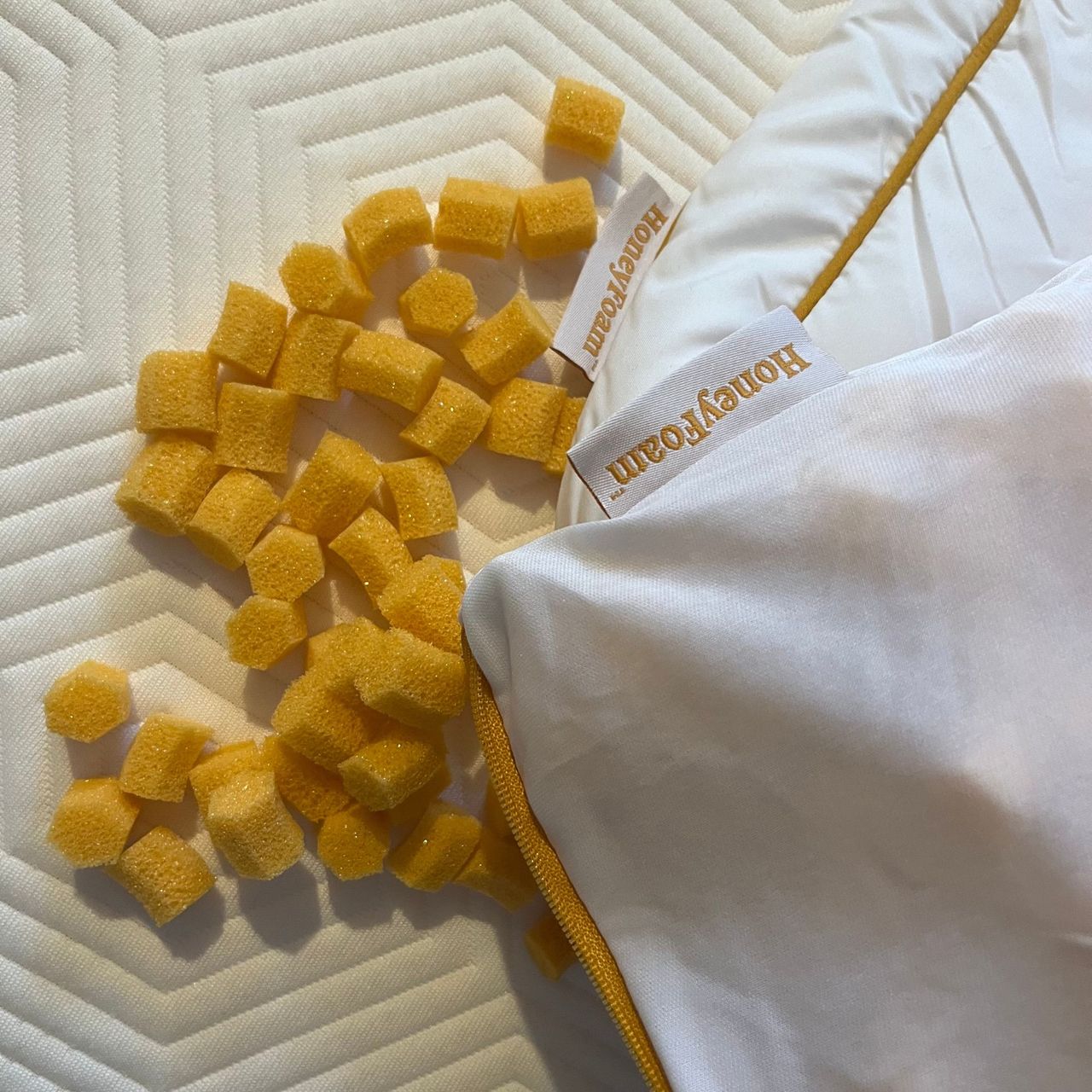 HoneyFoam clusters next to inner cover and outer cover on bed