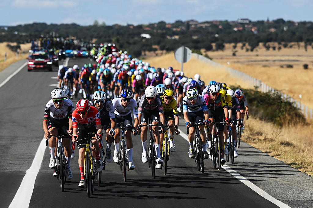 GUIJUELO, SPAIN - SEPTEMBER 12: (L-R) Joao Almeida of Portugal and UAE Team Emirates - XRG, Jonas Vingegaard of Denmark and Team Visma | Lease a Bike - Red Leader Jersey, Marcel Camprubi of Spain and Team Q36.5 Pro Cycling, Giulio Pellizzari of Italy and Team Red Bull - BORA - hansgrohe - White Best Young Rider Jersey, Oscar Rieseek of Netherlands and Team Alpecin - Deceuninck, Sepp Kuss of The United States and Team Visma | Lease a Bike and a general view of the peloton competing during the La Vuelta - 80th Tour of Spain 2025, Stage 19 a 161.9km stage from Rueda to Guijuelo / #UCIWT / on September 12, 2025 in Guijuelo, Spain. (Photo by Dario Belingheri/Getty Images)