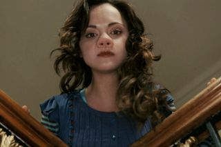 Christina Ricci with a pig nose leaning over a staircase in 'Penelope'