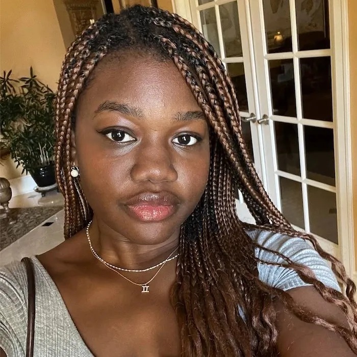 Associate beauty editor Maya Thomas wearing Merit Signature Lip Lightweight Lipstick.