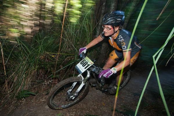 Open women's competitor Jody Bush flies through the rainforest in the Sterling Valley.