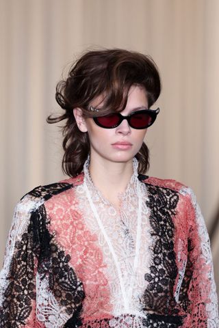 Model at Vivienne Westwood wearing 80s volume, a key Spring/Summer 2025 fashion month beauty look