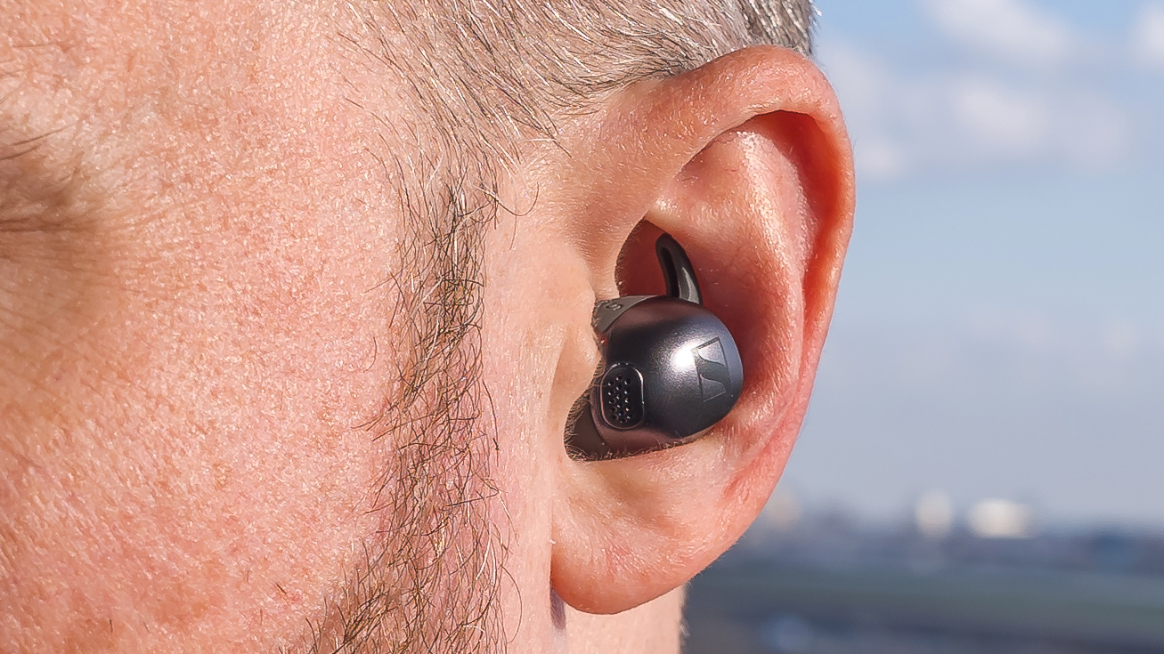 Sennheiser Momentum Sport earbud close up in ear.