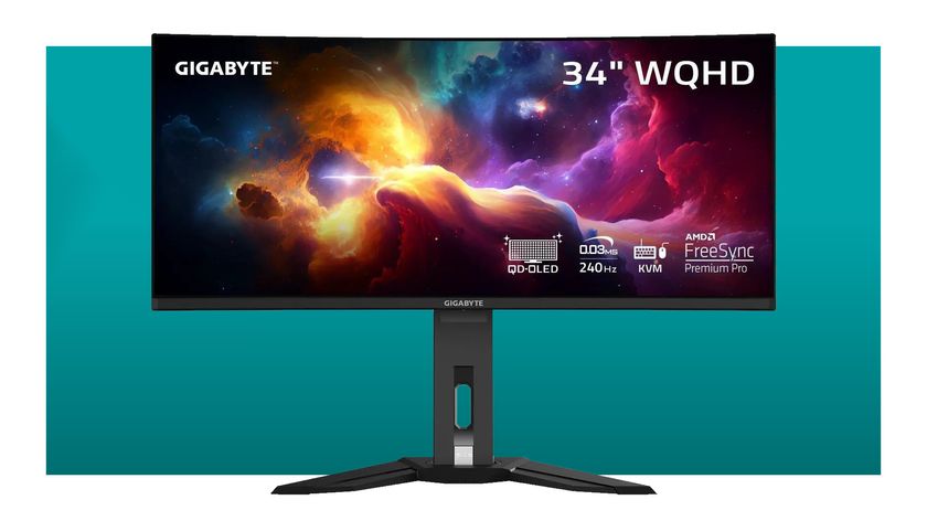 A Gigabyte MO34WQC2 QD-OLED ultrawide gaming monitor on a teal deals background