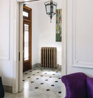 traditional cast iron radiator in hallway