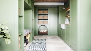 pale green utility room with built-in dog bed
