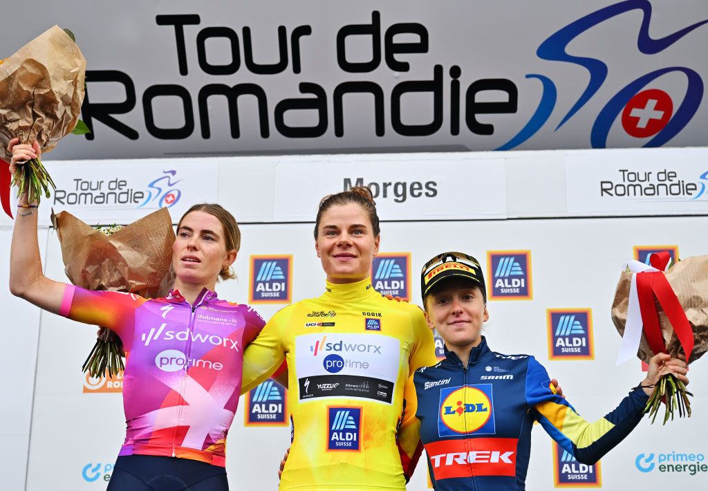 MORGES SWITZERLAND SEPTEMBER 08 LR Demi Vollering of The Netherlands and Team SD Worx Protime on second place overall race winner Lotte Kopecky of Belgium and Team SD Worx Protime Yellow Leader Jersey and Gaia Realini of Italy and Team Lidl Trek on third place pose on the podium ceremony after the 3rd Tour de Romandie Feminin 2024 Stage 3 a 1442km stage from Morges to Morges UCIWWT on September 08 2024 in Morges Switzerland Photo by Luc ClaessenGetty Images