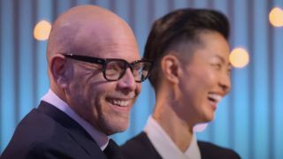 Alton Brown and Kristen Kish laughing on Iron Chef: Quest for an Iron Legend