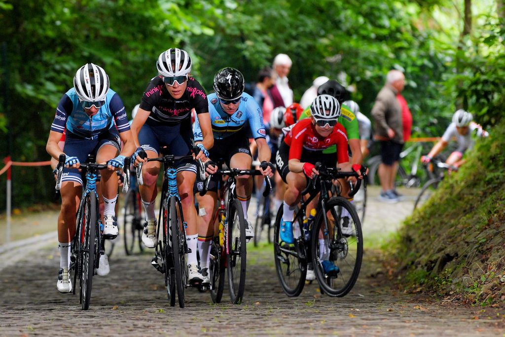 GERAARDSBERGEN BELGIUM JUNE 25 Ellen Van Dijk of The Netherlands Black Queen of the Stones Jersey Trixi Worrack of Germany and Team Trek Segafredo passing through Muur van Geraardsbergen cobblestones sector during the 9th Lotto Belgium Tour 2021 Stage 3 a 1011km stage from Geraardsbergen to Geraardsbergen 101m MuurKapelmuur LottoBelgTour LottoBelgiumTour on June 25 2021 in Geraardsbergen Belgium Photo by Luc ClaessenGetty Images