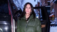 Courteney Cox in a green puffer coat