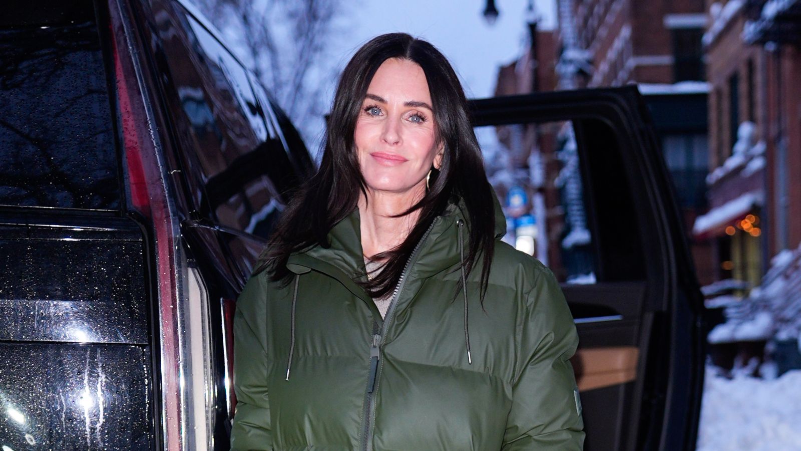 Courteney Cox in a green puffer coat