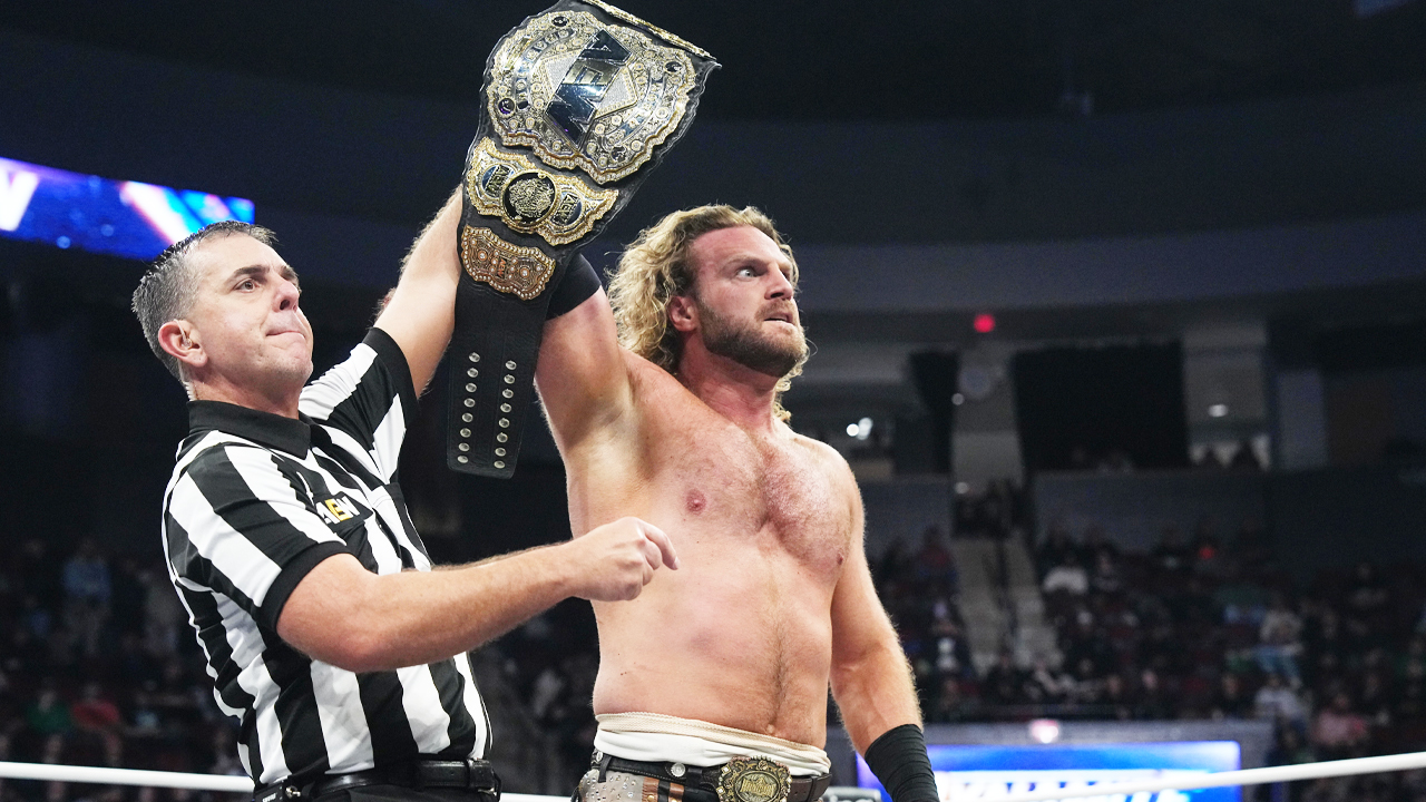 &#039;Hangman&#039; Adam Page holds up the AEW World Championship ahead of facing Samoa Joe