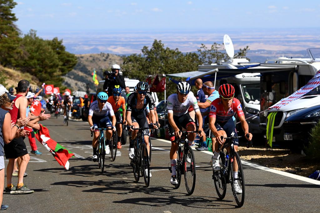 NAVACERRADA SPAIN SEPTEMBER 10 LR Thymen Arensman of Netherlands and Team DSM Juan Ayuso Pesquera of Spain and UAE Team Emirates White Best Young Rider Jersey and Remco Evenepoel of Belgium and Team QuickStep Alpha Vinyl Red Leader Jersey compete during the 77th Tour of Spain 2022 Stage 20 a 181km stage from Moralzarzal to Puerto de Navacerrada 1851m LaVuelta22 WorldTour on September 10 2022 in Puerto de Navacerrada Spain Photo by Tim de WaeleGetty Images
