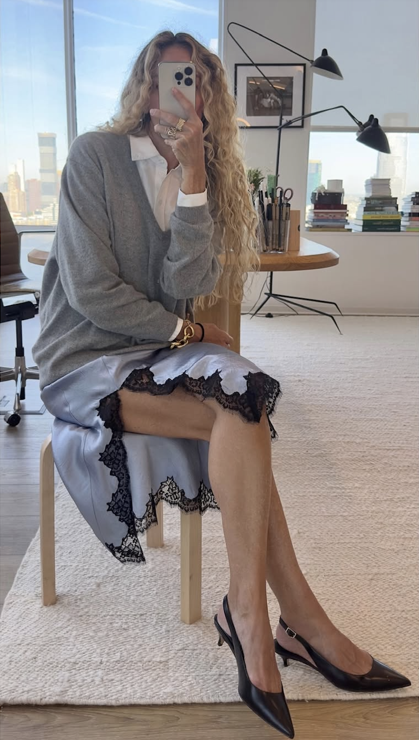 @olympiamarie wears grey jumper, white shirt and blue lace skirt
