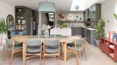 open plan family kitchen diner with wooden dining table and grey kitchen units