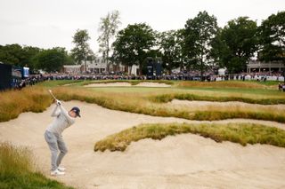 Matt Fitzpatrick of England plays a shot from a fairway bunker on the 18th hole during the final round of the 122nd U.S. Open Championship at The Country Club.