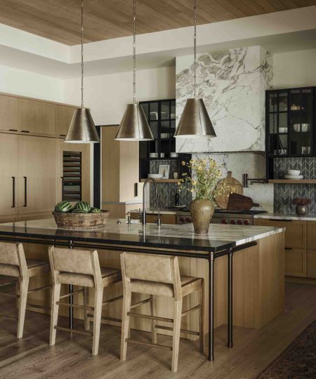 kitchen island with two worktops and a breakfast bar