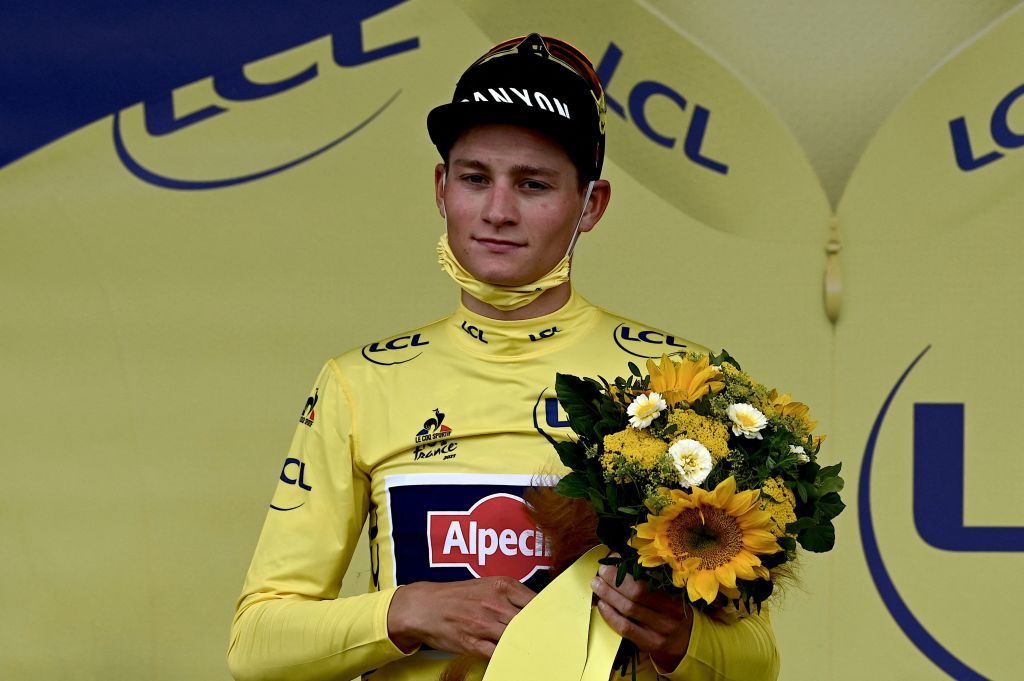 Team Alpecin Fenix Mathieu van der Poel of Netherlands celebrates his overall leader yellow jersey on the podium at the end of the 5th stage of the 108th edition of the Tour de France cycling race a 27 km time trial between Change and Laval on June 30 2021 Photo by Philippe LOPEZ AFP Photo by PHILIPPE LOPEZAFP via Getty Images