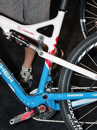 The seat tube is offset ahead of the bottom bracket to make more room for the tucked-in rear wheel.