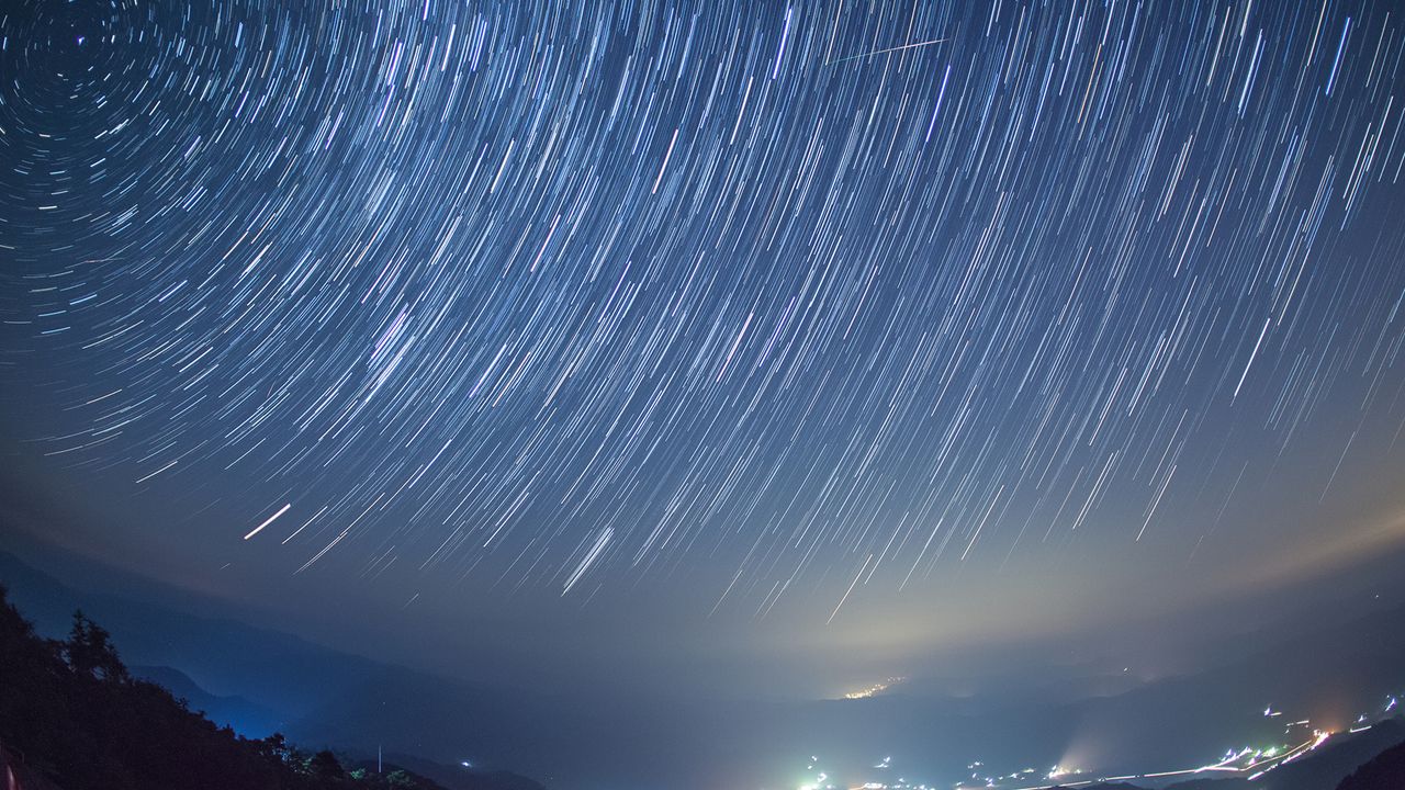Perseid meteor shower over Okayama, Japan. Shooting star through the middle of the frame.