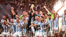 Argentina captain Lionel Messi lifts the Fifa World Cup 
