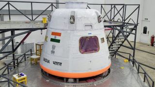 A view of a white module with the Indian flag painted on the side.