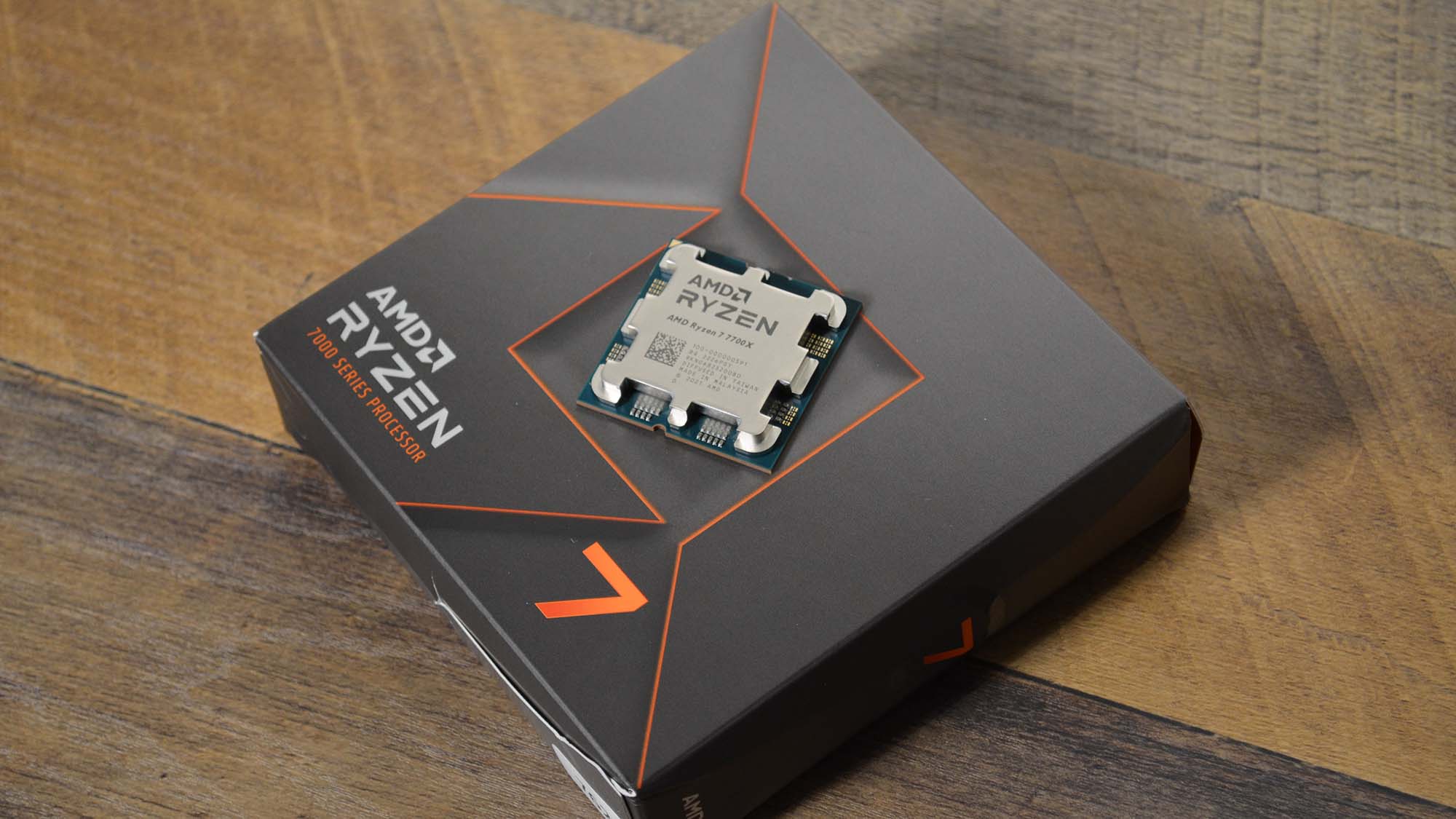 An AMD Ryzen 7 7700X with its retail packaging
