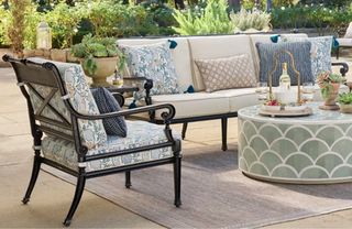 A classic outdoor furniture set on a paved patio