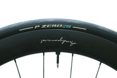 A close up of a black road bike tyre