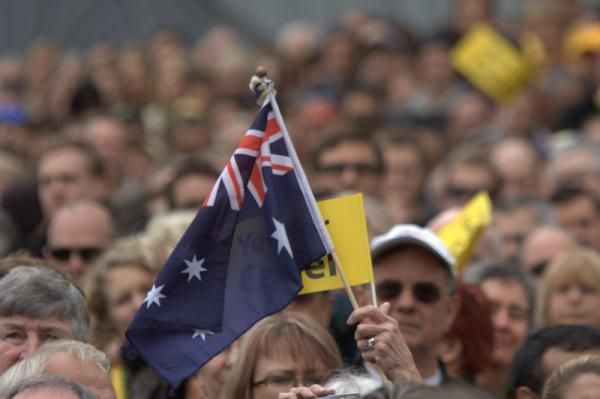 An Aussie flag in the crowd in Federation Square