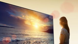 Woman looking at Sony A1E OLED TV