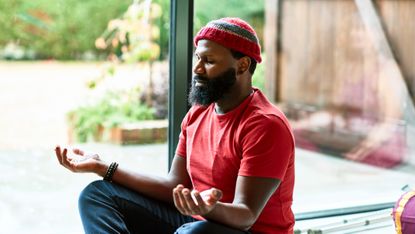 Man meditating during the day