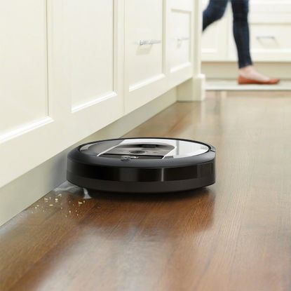 iRobot Roomba i6+ in kitchen picking up dirt