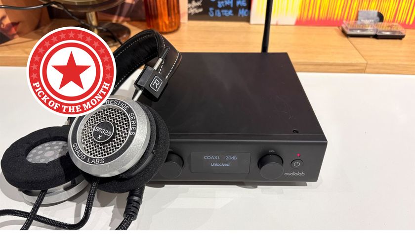 DAC on headphones on desk with Rewind logo