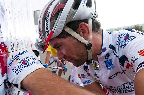 Velo Club-La Pomme Marseille's Julien Antomarchi makes sure of his signature in Danzhou.
